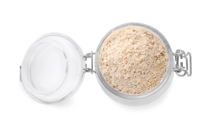 Photo of Brewer's yeast flakes in glass jar isolated on white, top view