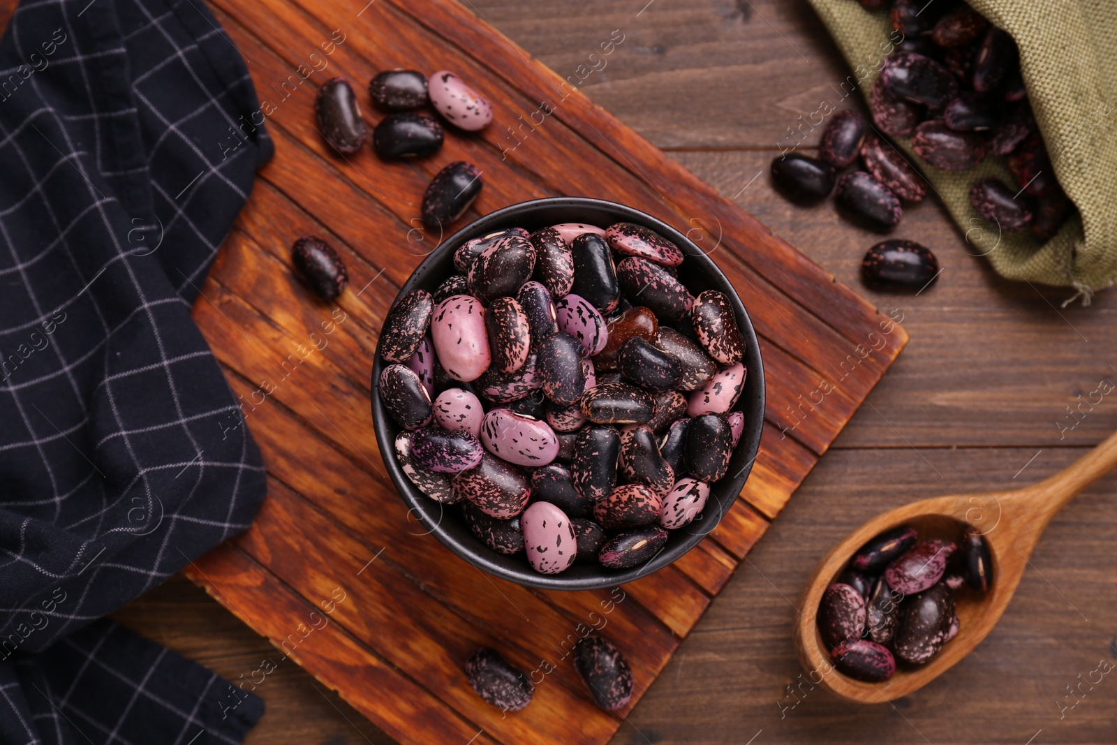 Photo of Many dry kidney beans on wooden table, flat lay