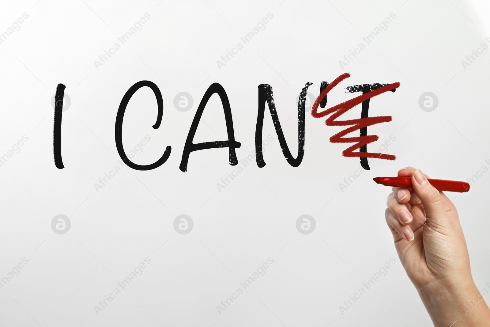 Image of Woman crossed out letter T in phrase I CAN'T on white background, closeup. Motivation and positivity