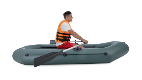 Photo of Man in life vest rowing inflatable rubber boat on white background