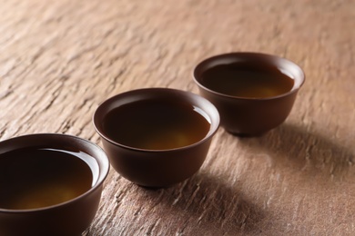 Cups of Tie Guan Yin oolong tea on table