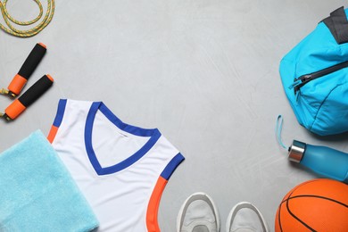Photo of Flat lay composition with sports equipment on grey background, space for text