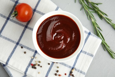 Photo of Flat lay composition with barbecue sauce on grey background