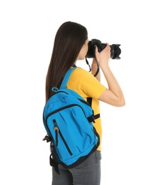 Photo of Young female photographer with camera on white background