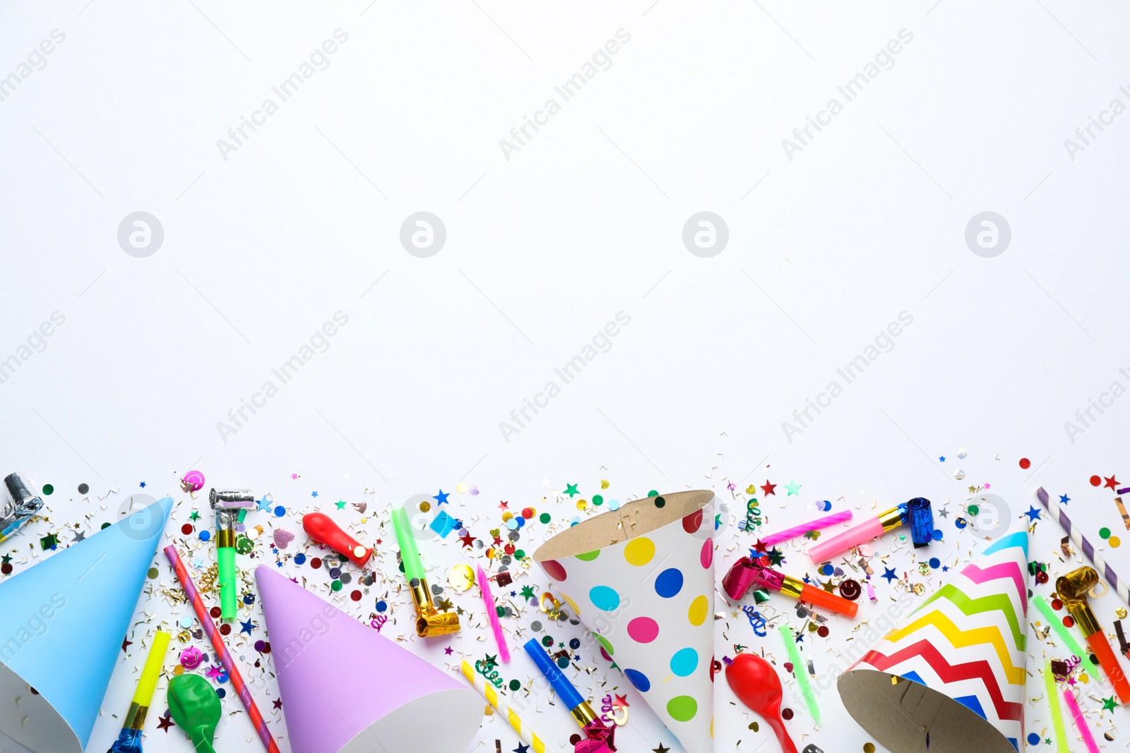 Photo of Beautiful flat lay composition with festive items on white background, space for text. Surprise party concept