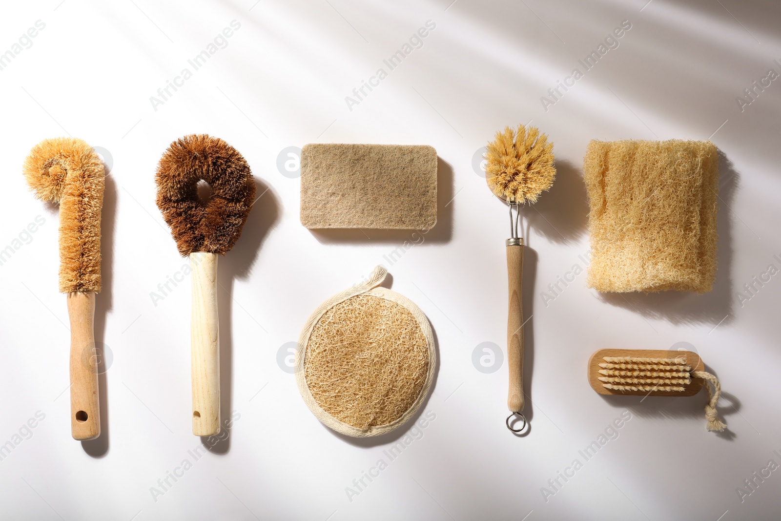 Photo of Flat lay composition with eco friendly products on white background