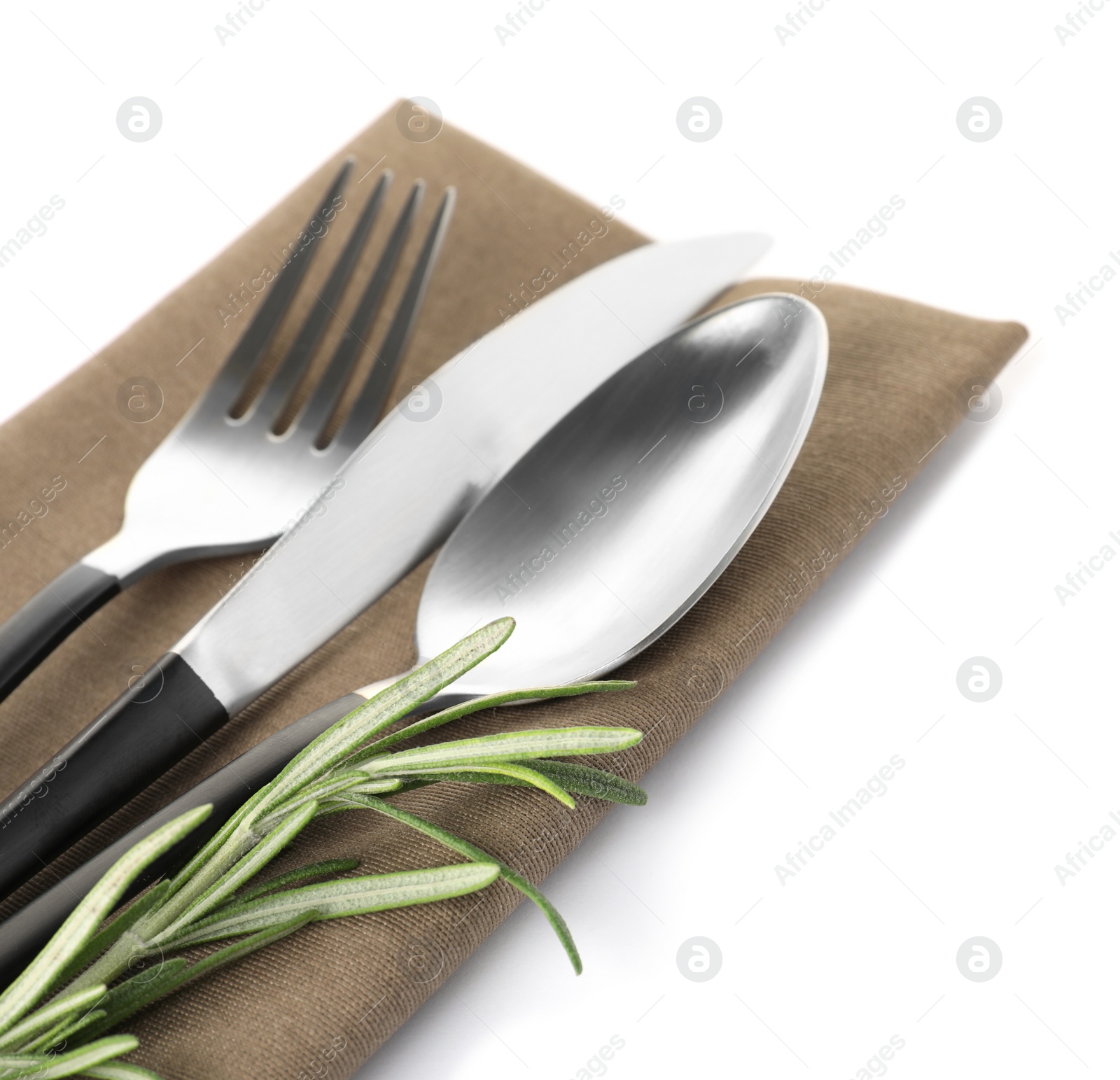 Photo of Cutlery and linen napkin on white background
