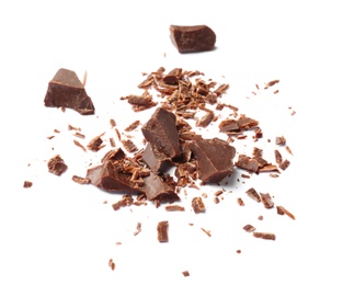 Photo of Delicious black chocolate shavings and pieces on white background