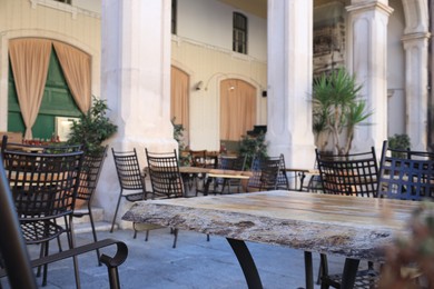 Photo of Outdoor cafe with stylish furniture and green plants