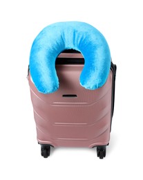 Photo of Soft travel pillow on suitcase isolated on white