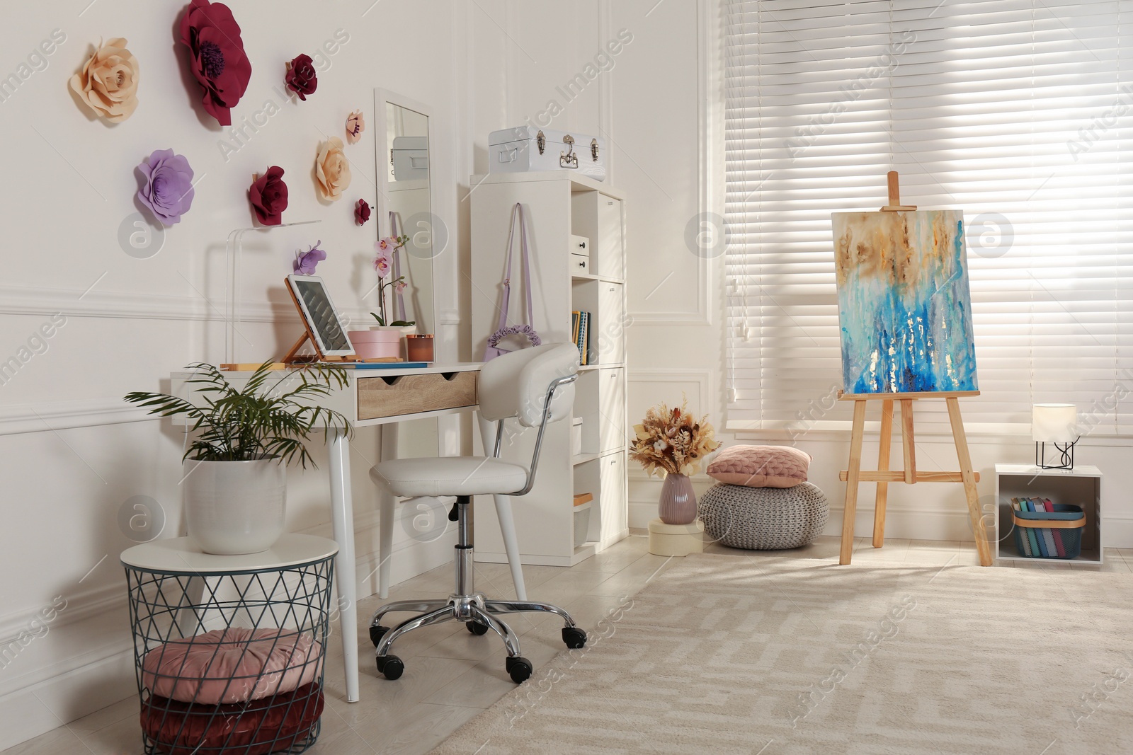 Photo of Stylish teenager's room interior with computer and painting easel