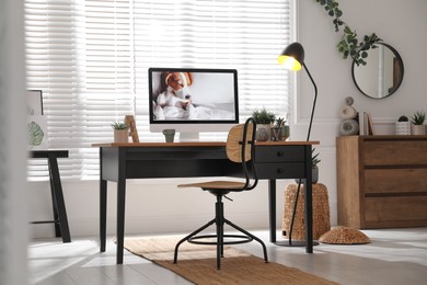 Photo of Stylish home office interior with comfortable workplace