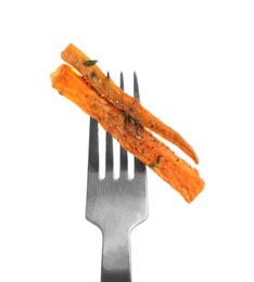 Fork with tasty sweet potato fries on white background