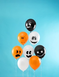 Photo of Color balloons for Halloween party on blue background