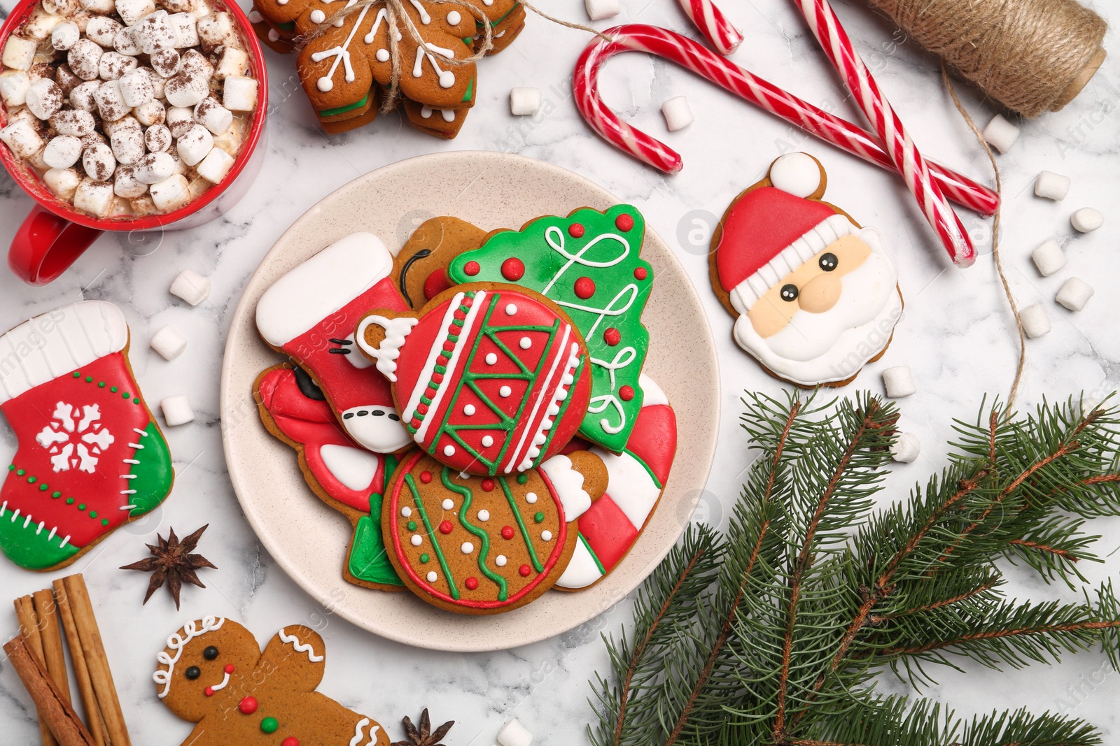 Photo of Flat lay composition with decorated Christmas cookies on white marble table