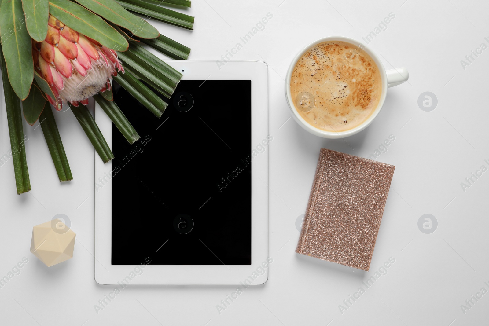 Photo of Creative flat lay composition with tropical flower, tablet and cup of coffee on white background