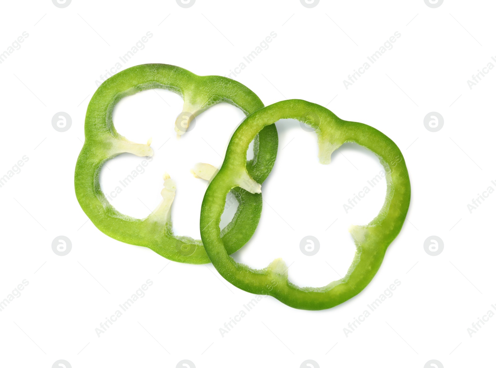 Photo of Rings of tasty green bell pepper on white background, top view