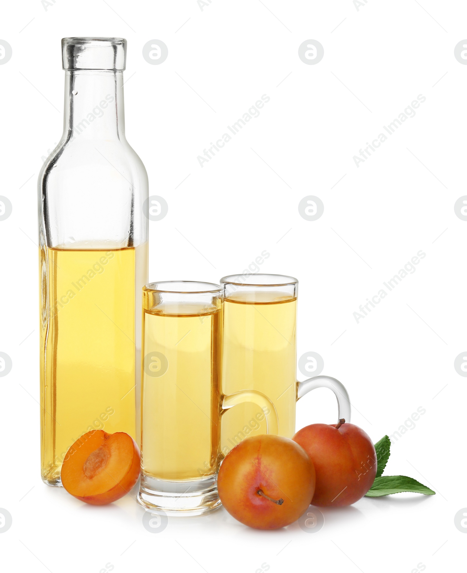 Photo of Delicious plum liquor and ripe fruits on white background. Homemade strong alcoholic beverage