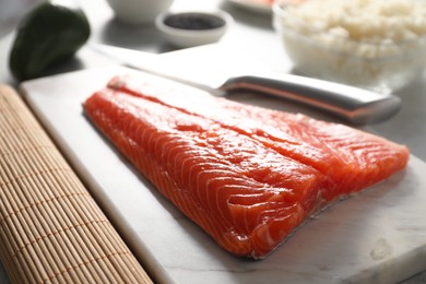 Photo of Fresh salmon for sushi on table, closeup