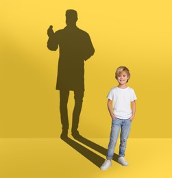 Image of Dream about future occupation. Smiling boy and silhouette of singer on yellow background