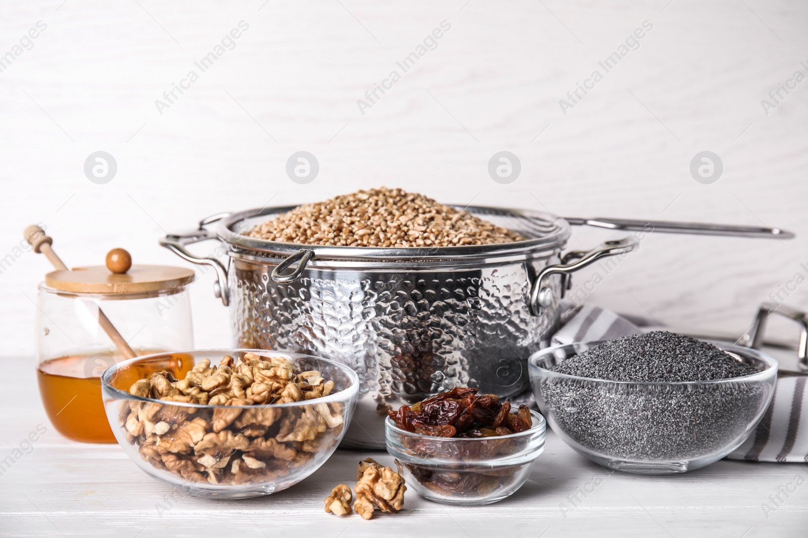 Photo of Ingredients for traditional kutia on white wooden table
