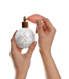 Photo of Woman holding bottle of luxury perfume on white background, closeup