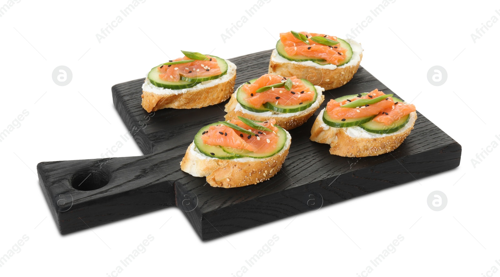 Photo of Tasty canapes with salmon, cucumber and cream cheese isolated on white