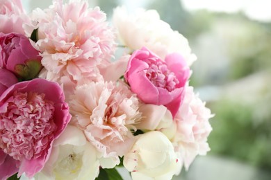 Beautiful peony bouquet on blurred background, closeup