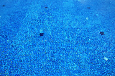 Outdoor swimming pool with clear water on sunny day