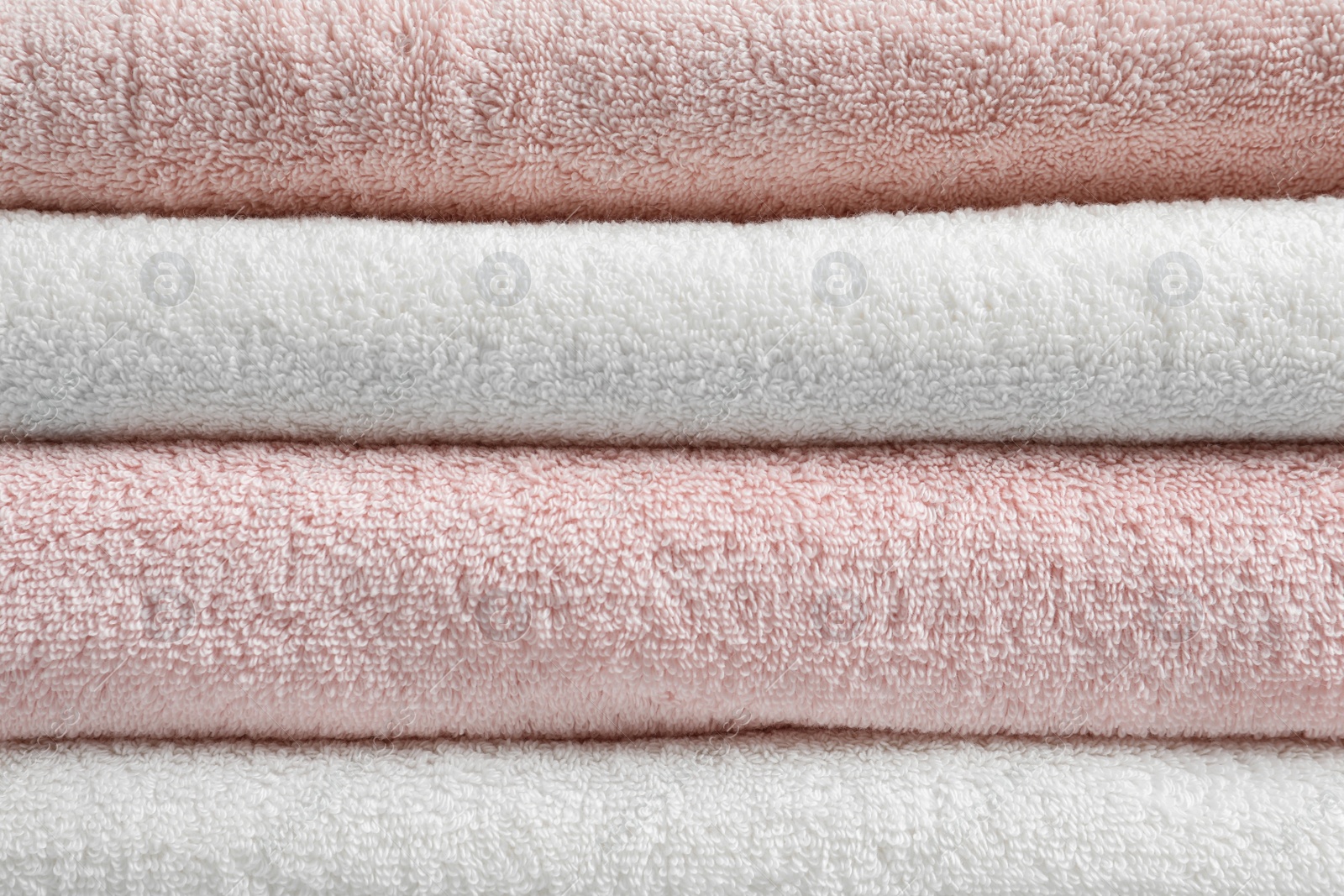 Photo of Stack of fresh soft towels as background