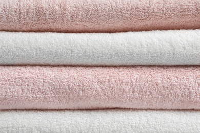 Photo of Stack of fresh soft towels as background