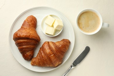 Photo of Flat lay composition with tasty croissants served on light table