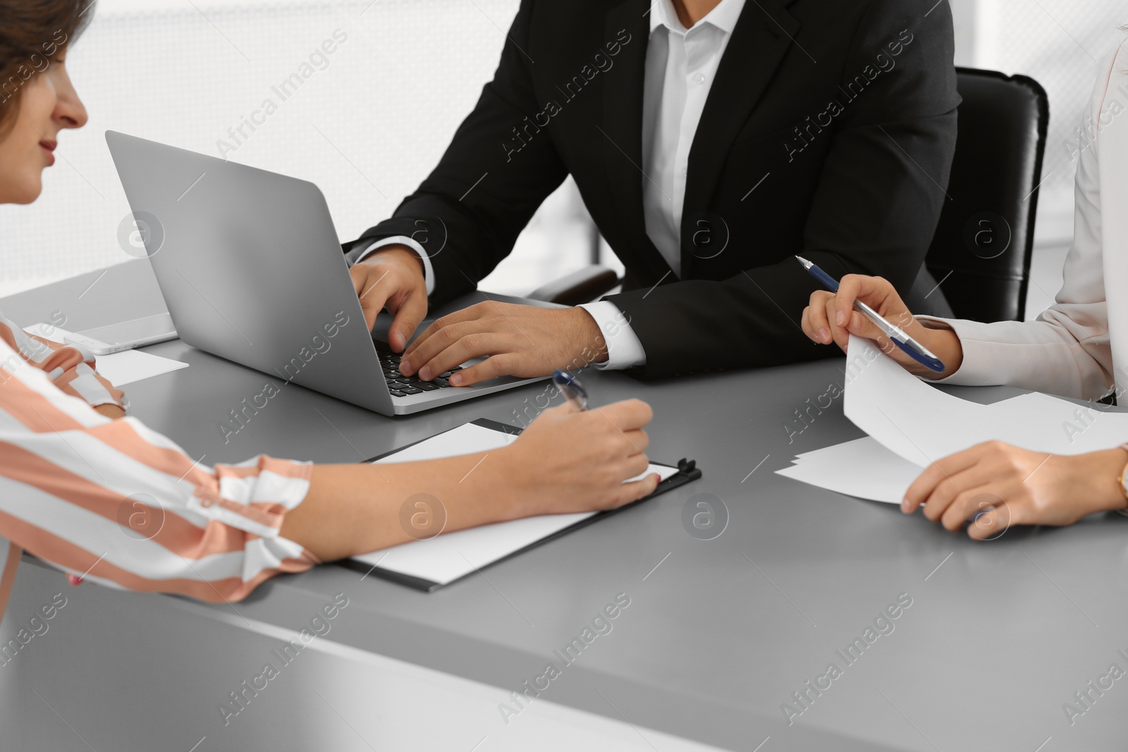 Photo of Human resources commission conducting job interview with applicant in office, closeup