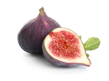 Whole and cut purple figs on white background