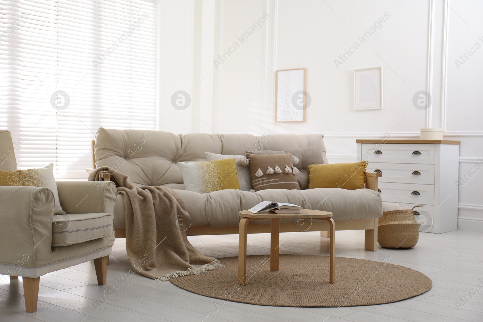 Photo of Stylish living room interior with comfortable sofa and armchair