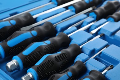 Photo of Set of screwdrivers in toolbox as background, closeup
