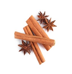 Cinnamon sticks and anise stars isolated on white, top view