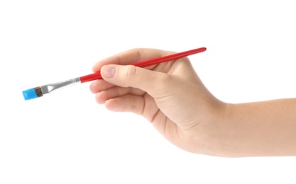 Young woman holding brush with color paint on white background, closeup