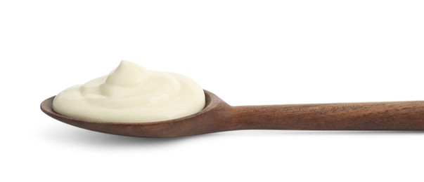 Photo of Fresh mayonnaise sauce in wooden spoon isolated on white