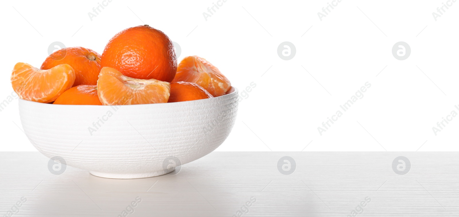 Photo of Delicious fresh tangerines on table against white background. Space for text