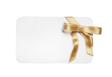 Blank gift card with golden bow isolated on white, top view