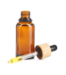 Photo of Glass bottle and pipette with tincture isolated on white