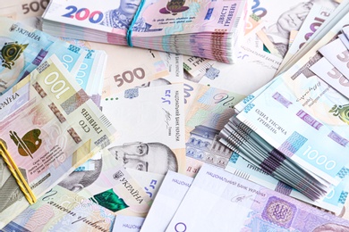 Photo of Closeup view of Ukrainian money as background. National currency