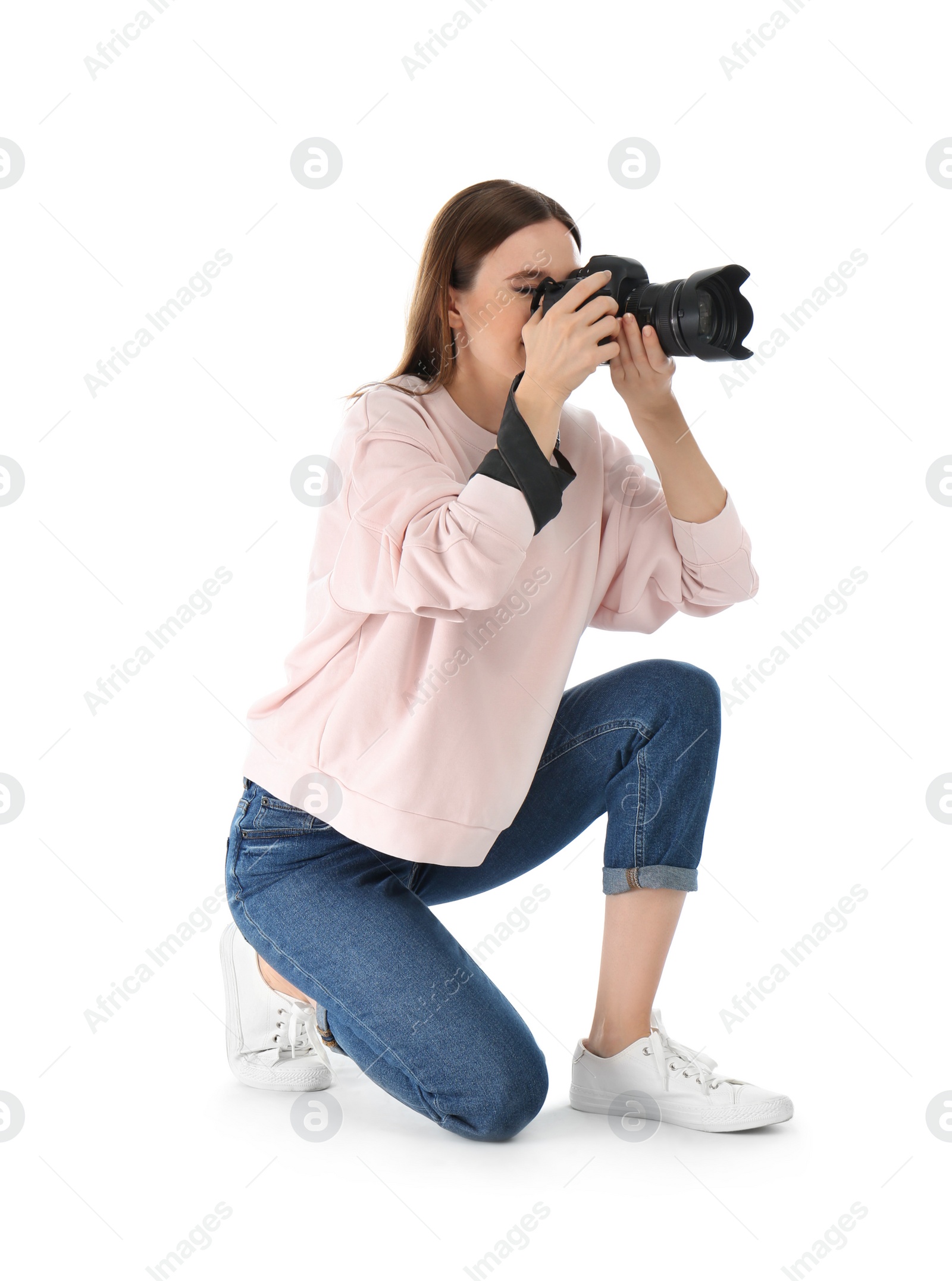 Photo of Professional photographer taking picture on white background