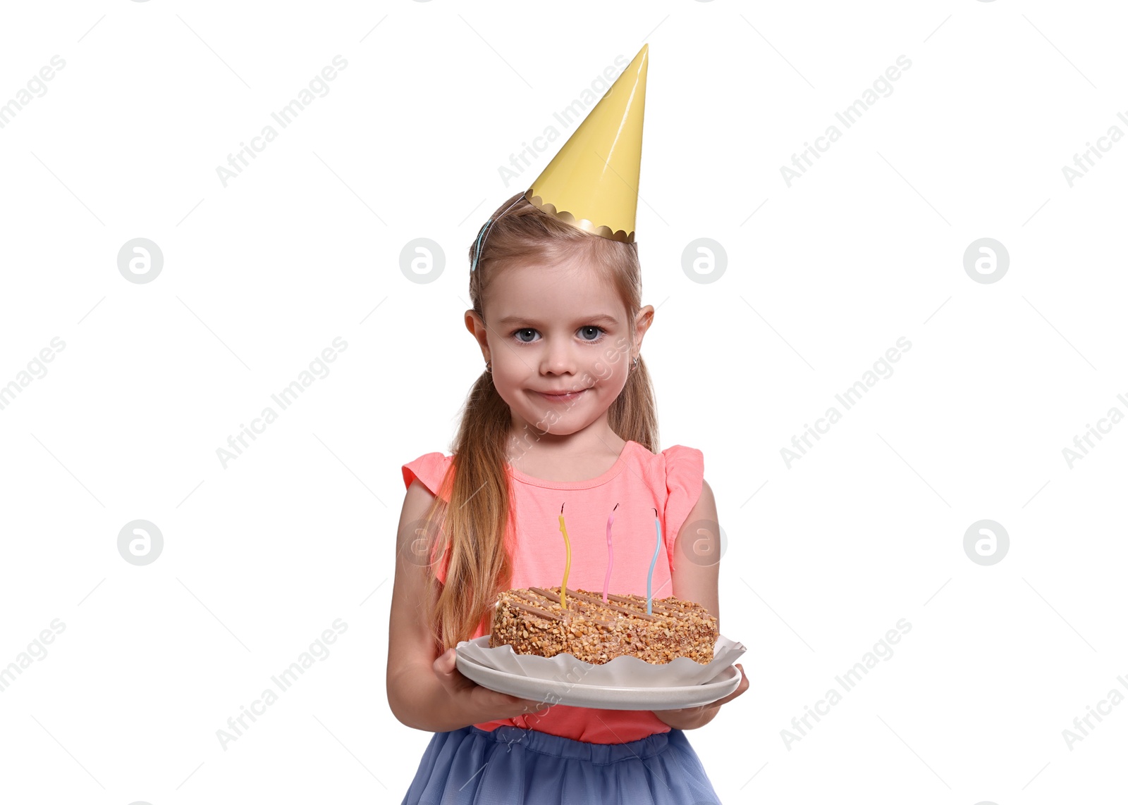 Photo of Birthday celebration. Cute little girl in party hat holding tasty cake on white background