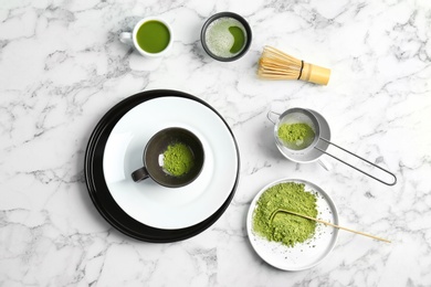 Photo of Flat lay composition with matcha tea on marble table