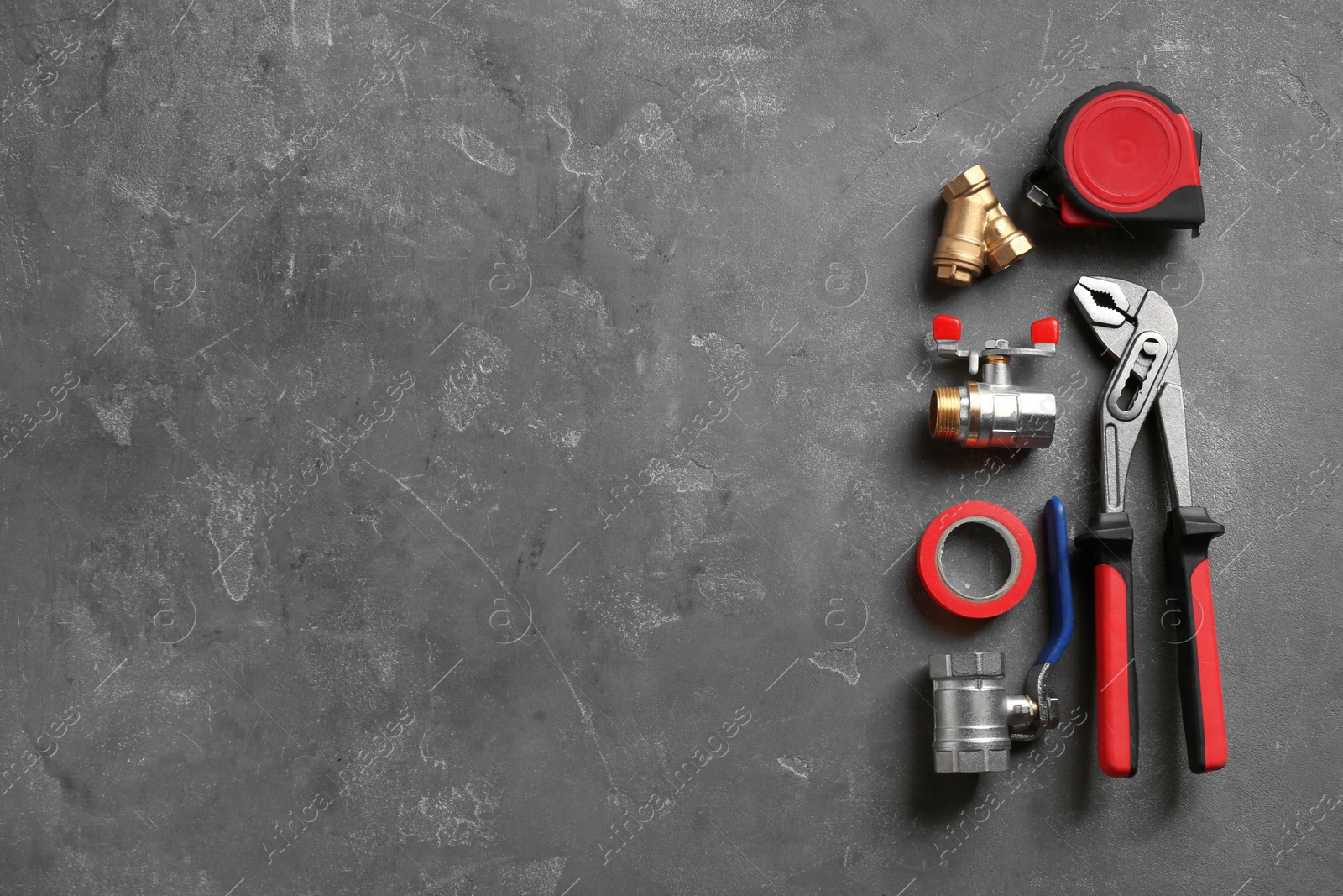 Photo of Flat lay composition with plumber's tools and space for text on gray background