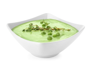 Photo of Bowl with green pea soup on white background