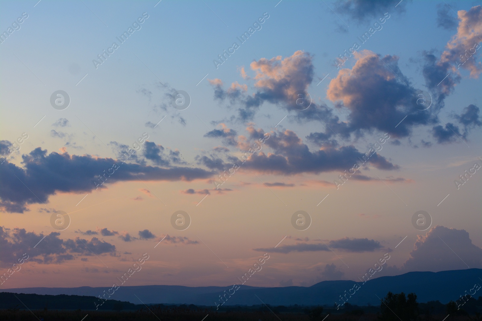 Photo of Picturesque view of beautiful countryside at sunset