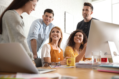 Photo of Team of professional designers working in office